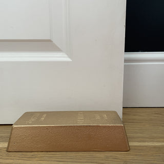 Bar of gold weighted doorstop